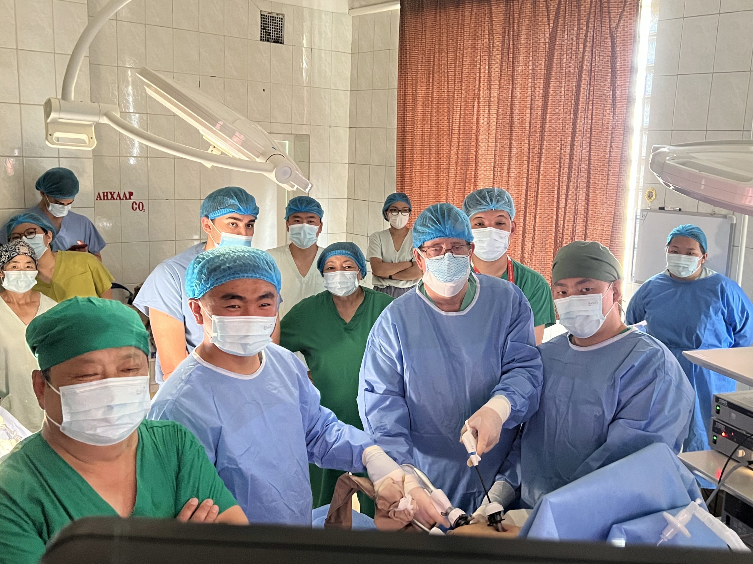 Group of doctors learning how to perform laparoscropic surgery in Mongolia.