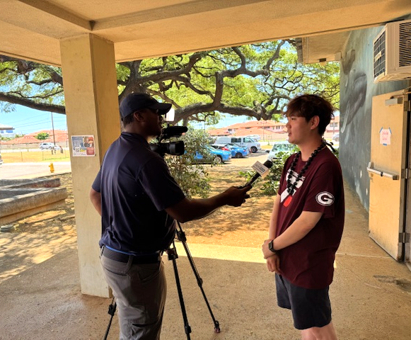 UAC students are interviewed by a local TV station during the Honolulu International Esports Tournament.